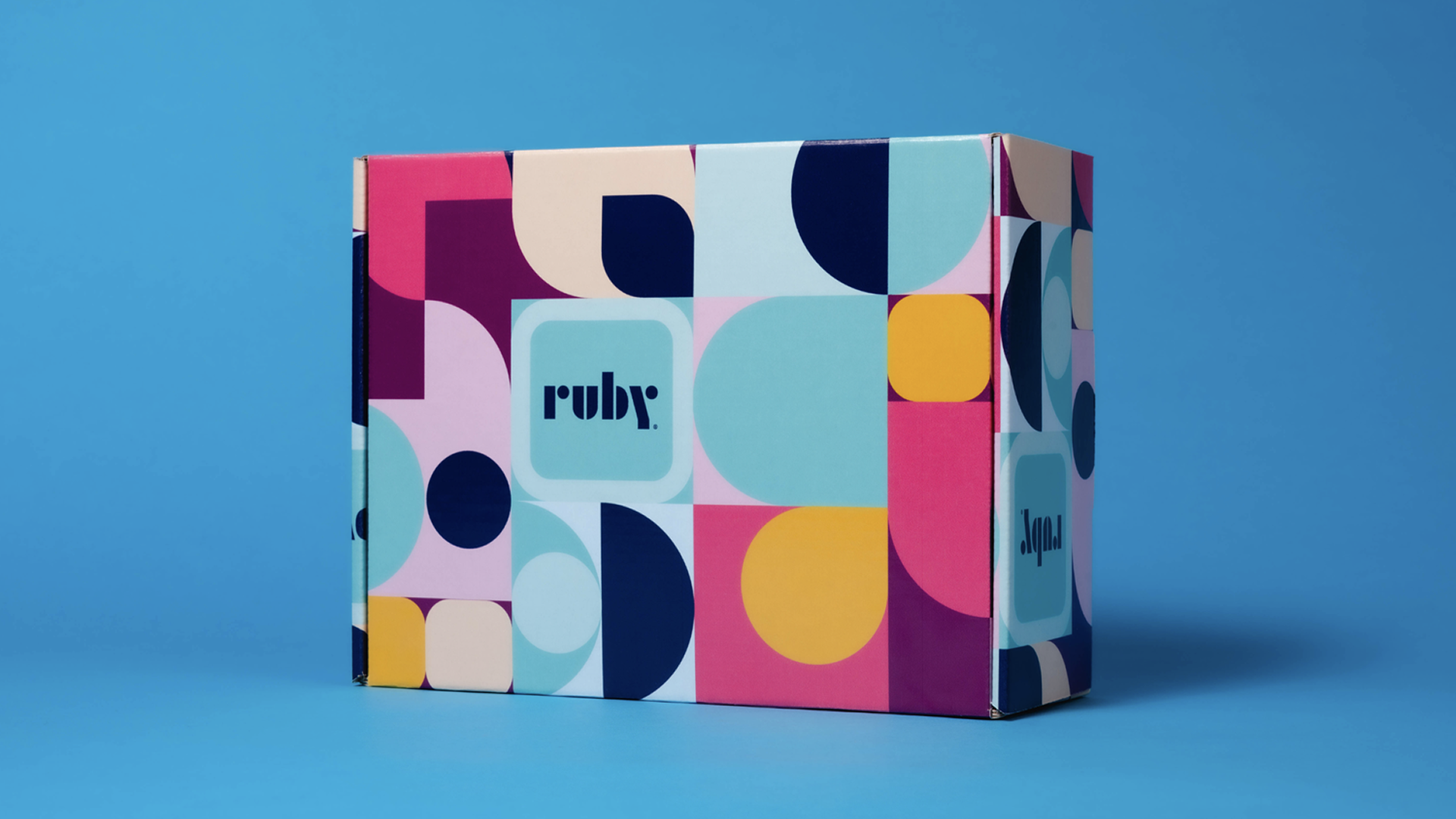 Colorful Ruby gift box against a blue background